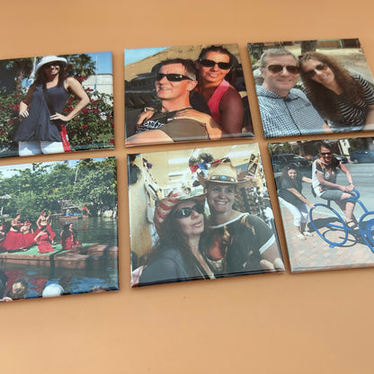 Six photo prints of people in various settings on a beige surface