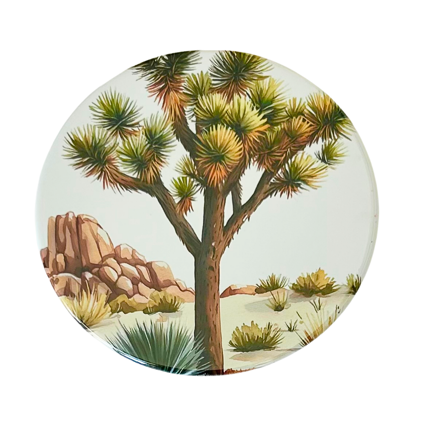 Square coaster featuring a watercolor illustration of a single Joshua tree with desert scrub, agave, and pink boulder formations against a soft white background.
