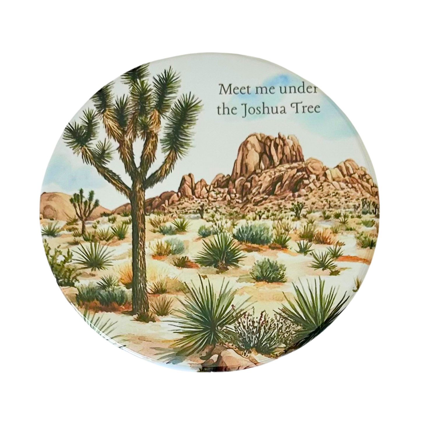 Square coaster featuring a watercolor desert landscape with a Joshua tree, yucca plants, boulder formations, and the text "Meet me under the Joshua Tree."