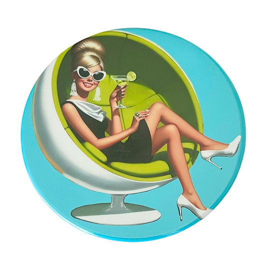 Mid-century pin-up blonde woman in cat-eye sunglasses with tassel earrings sitting in a lime green ball chair holding a lime martini, crisp aqua blue background, retro cocktail hour coaster