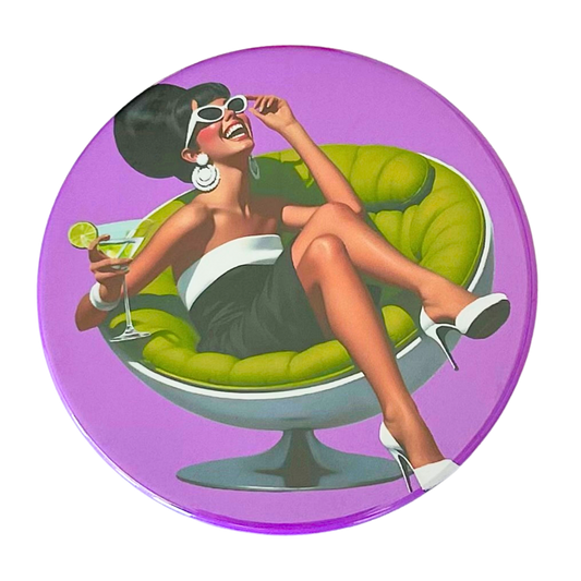 Mid-century pin-up woman in cat-eye sunglasses laughing with head thrown back in a green ball chair holding a martini, bold purple background, retro cocktail hour coaster