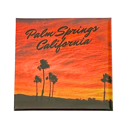 Palm Springs desert sunset magnet with warm orange sky and palm tree silhouettes, California souvenir