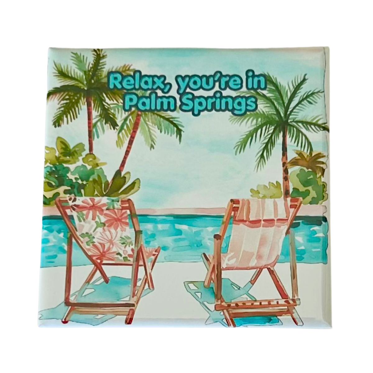 A square decorative magnet featuring a watercolor-style tropical beach scene with palm trees, a pool, and two deck chairs. The text 'Relax, you're in Palm Springs' appears across the top.