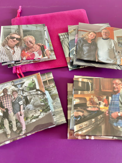 Collection of photo travel fridge magnets on a purple surface